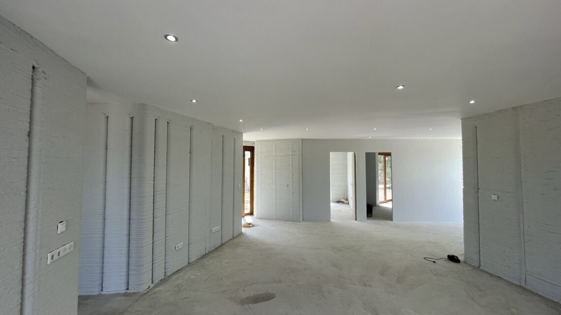Inside 3D printed building Plastered walls